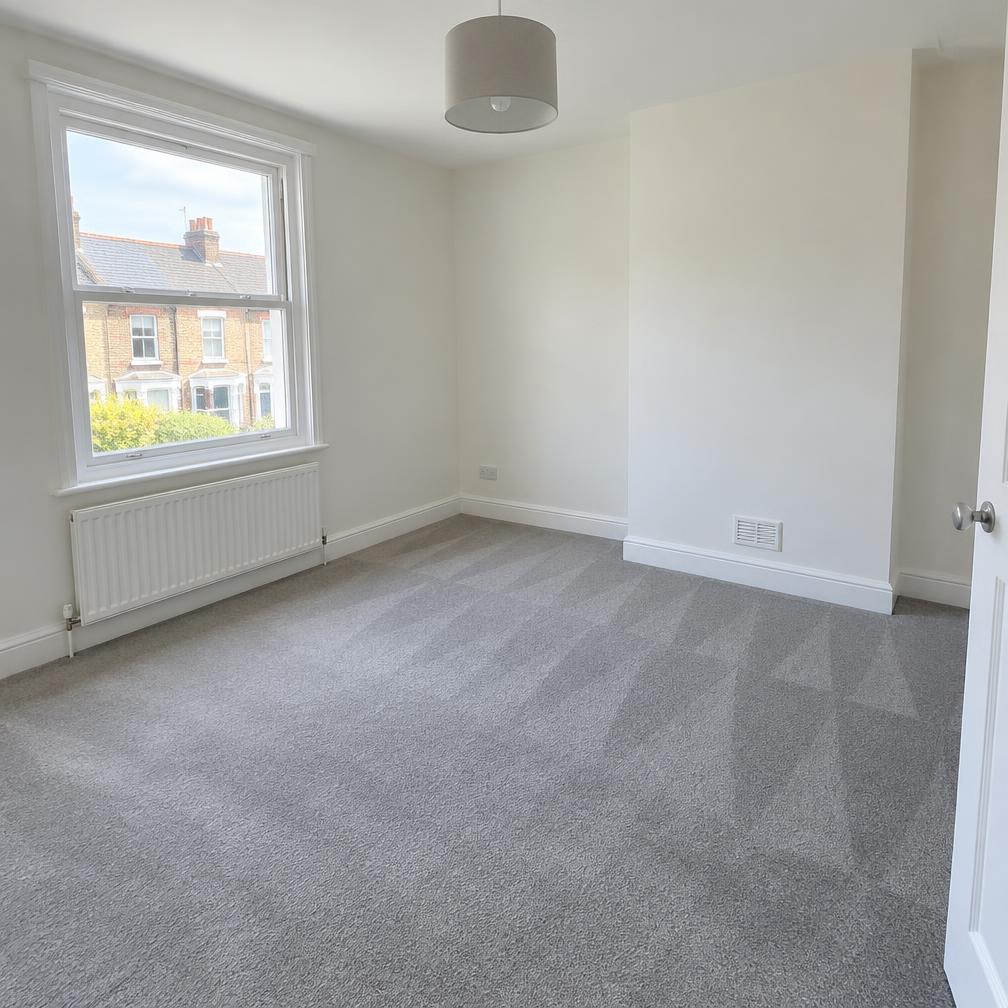 Freshly cleaned carpet in an empty bedroom